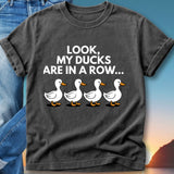 T-shirt with text "Look, my ducks are in a row..." and four cartoon ducks.