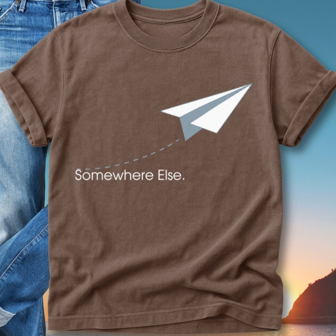 Brown t-shirt with white paper airplane graphic and text "Somewhere Else."