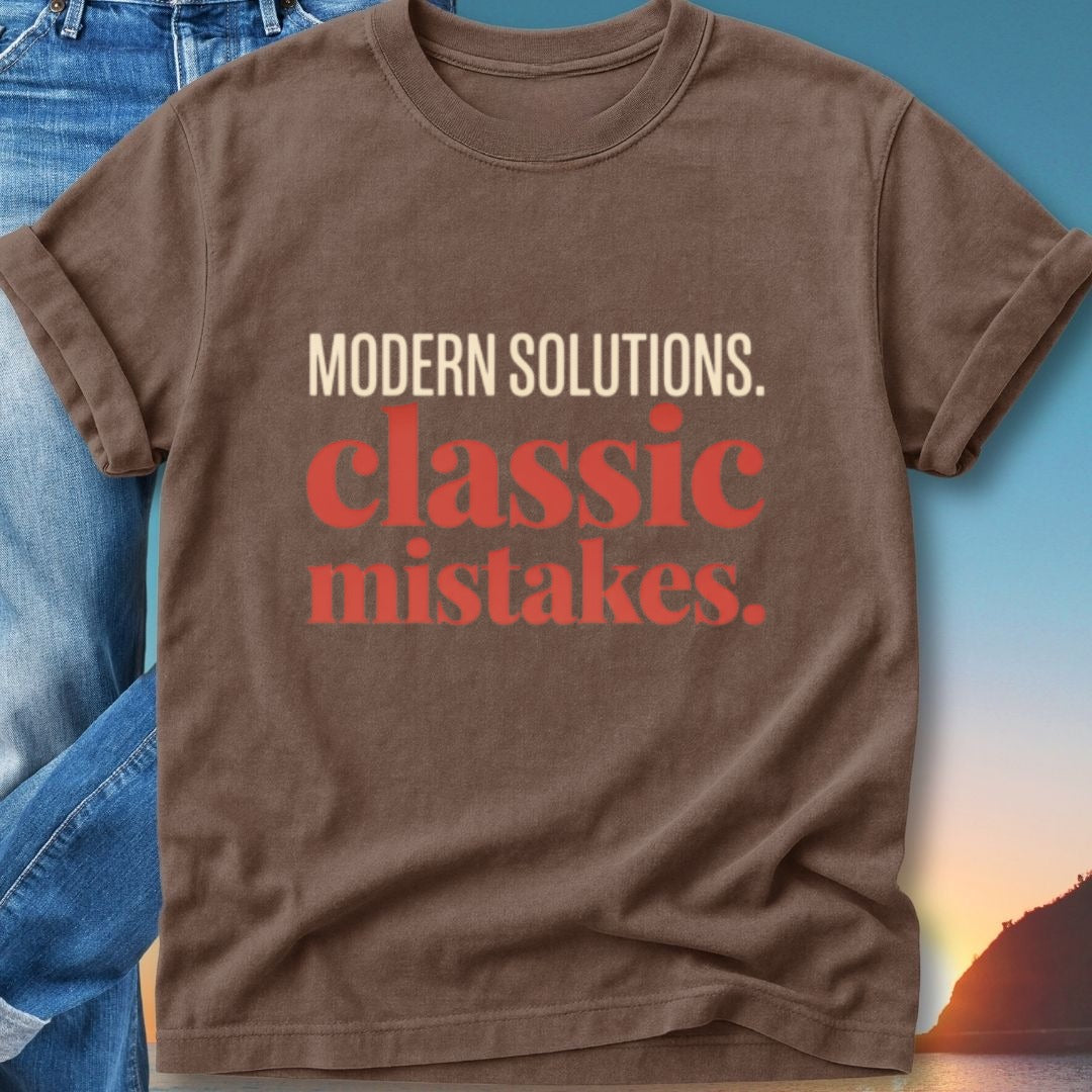 Brown t-shirt with text "MODERN SOLUTIONS. classic mistakes."