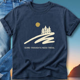 Dark blue t-shirt with trees, sun, and text "SOME THOUGHTS NEED TREES."