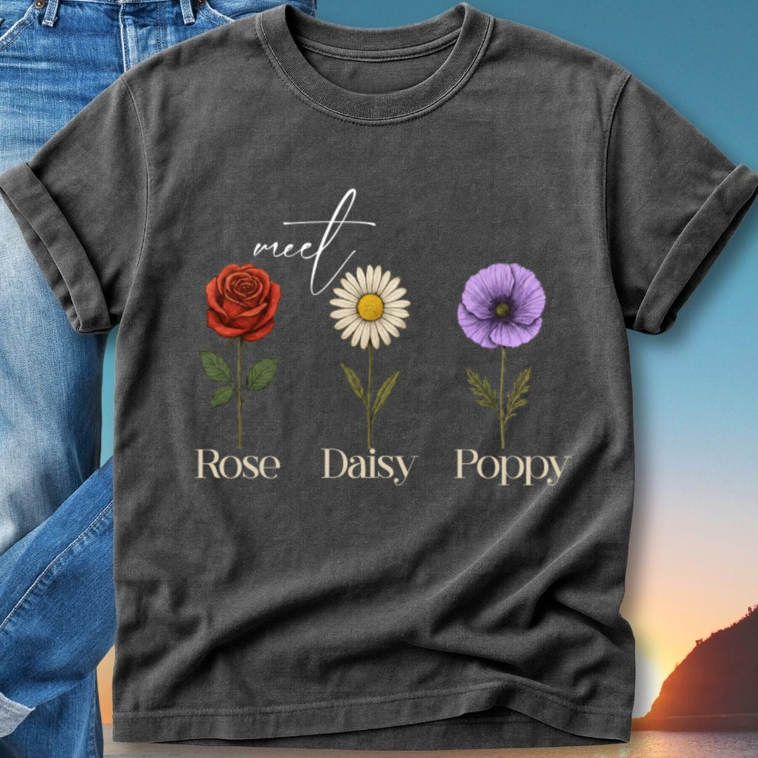 Dark t-shirt with floral graphic: Rose, Daisy, Poppy with names below.