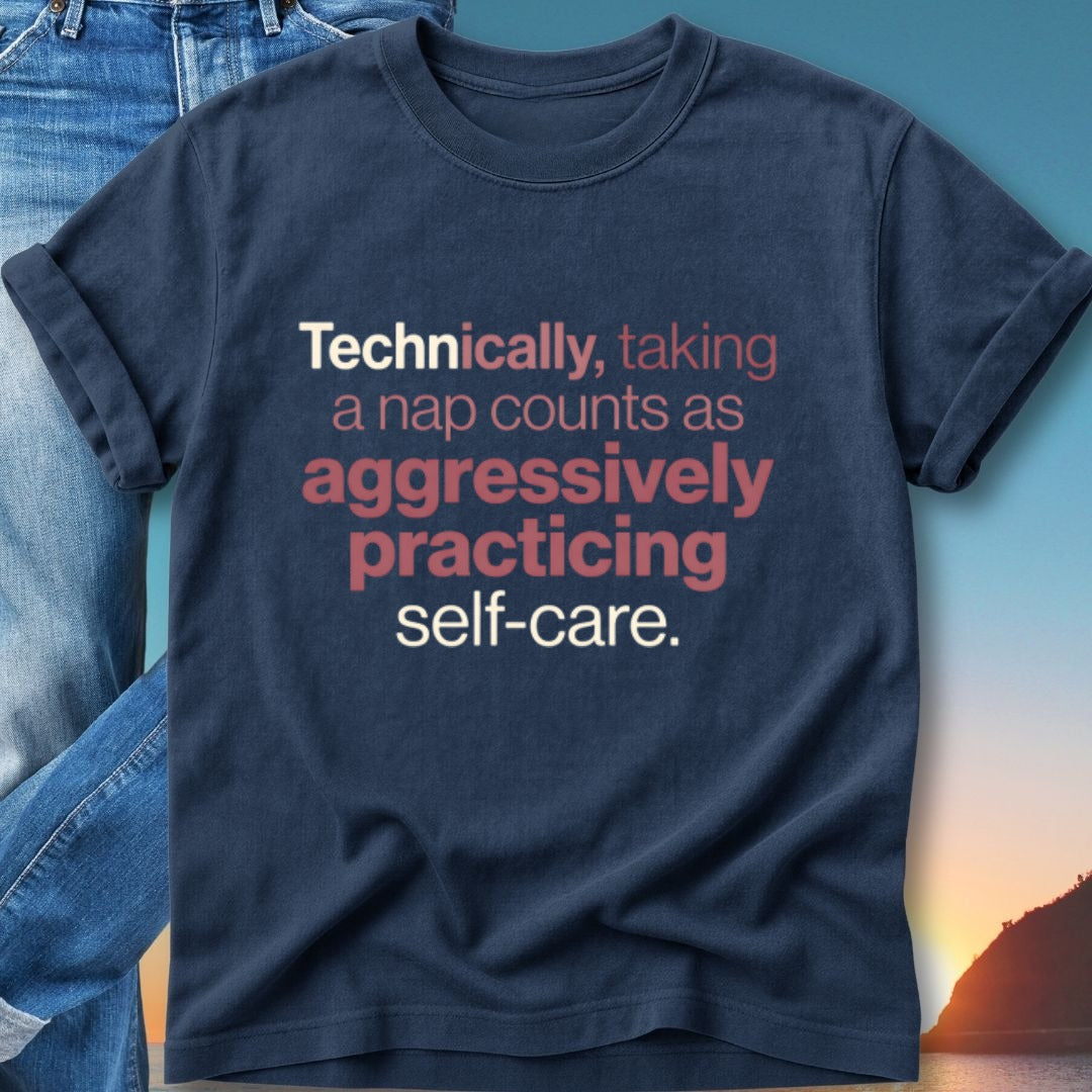 Navy t-shirt with text: "Technically, taking a nap counts as aggressively practicing self-care."