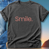 Dark gray t-shirt with "Smile." in pink text.