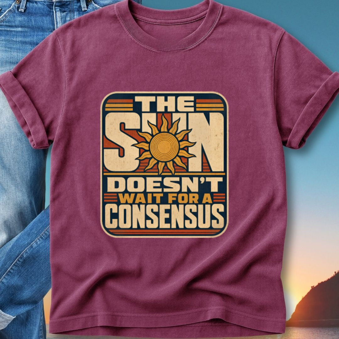 T-shirt with "The Sun Doesn't Wait For A Consensus" text and sun graphic.