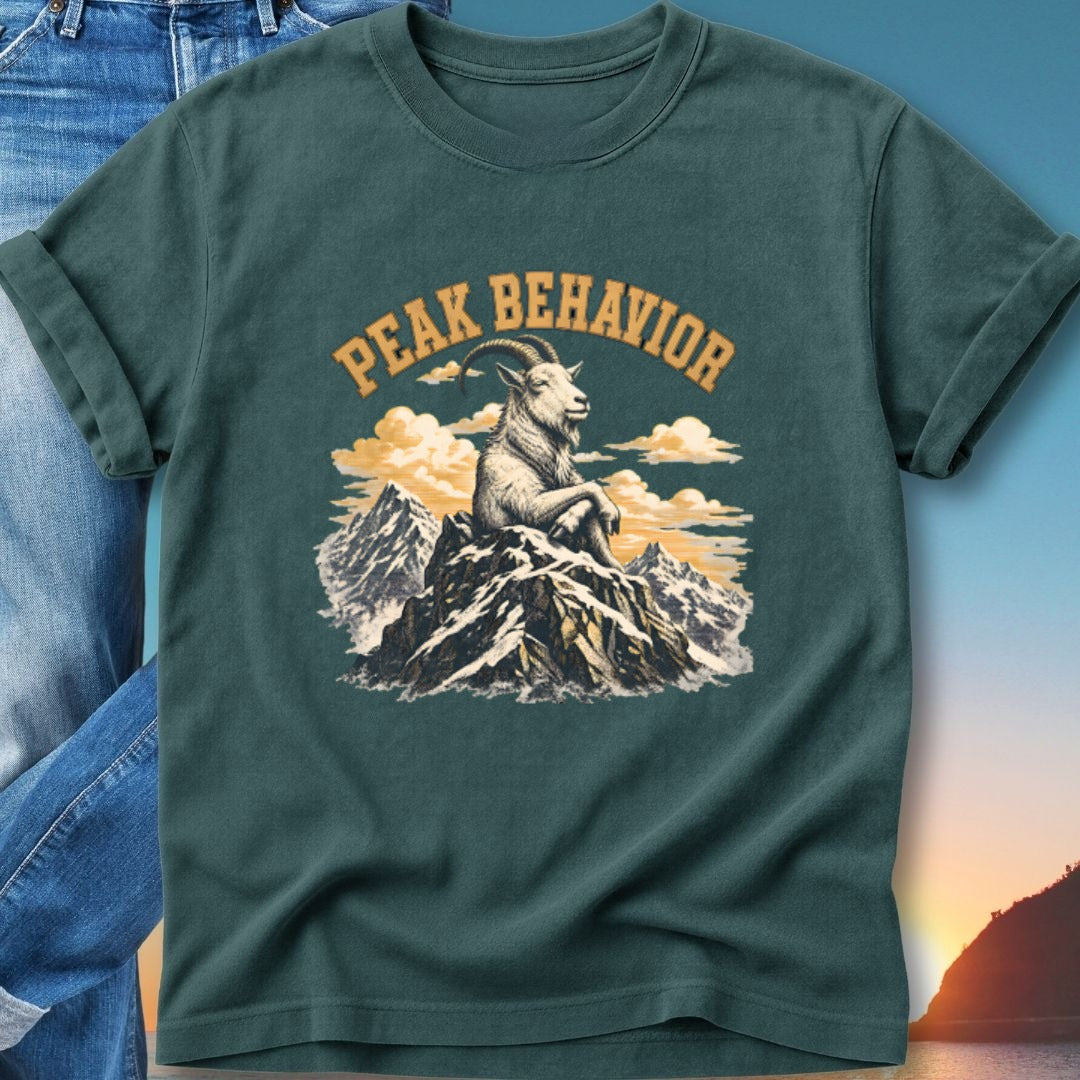 Teal t-shirt with mountain goat on peak, text reads "Peak Behavior".