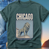 Dark teal t-shirt featuring a vintage style illustration of a lion statue with "CHICAGO" and "BRONZE & BOUNDARIES".