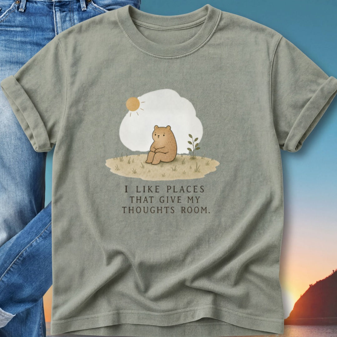 T-shirt with illustration of a bear sitting and text "I like places that give my thoughts room."