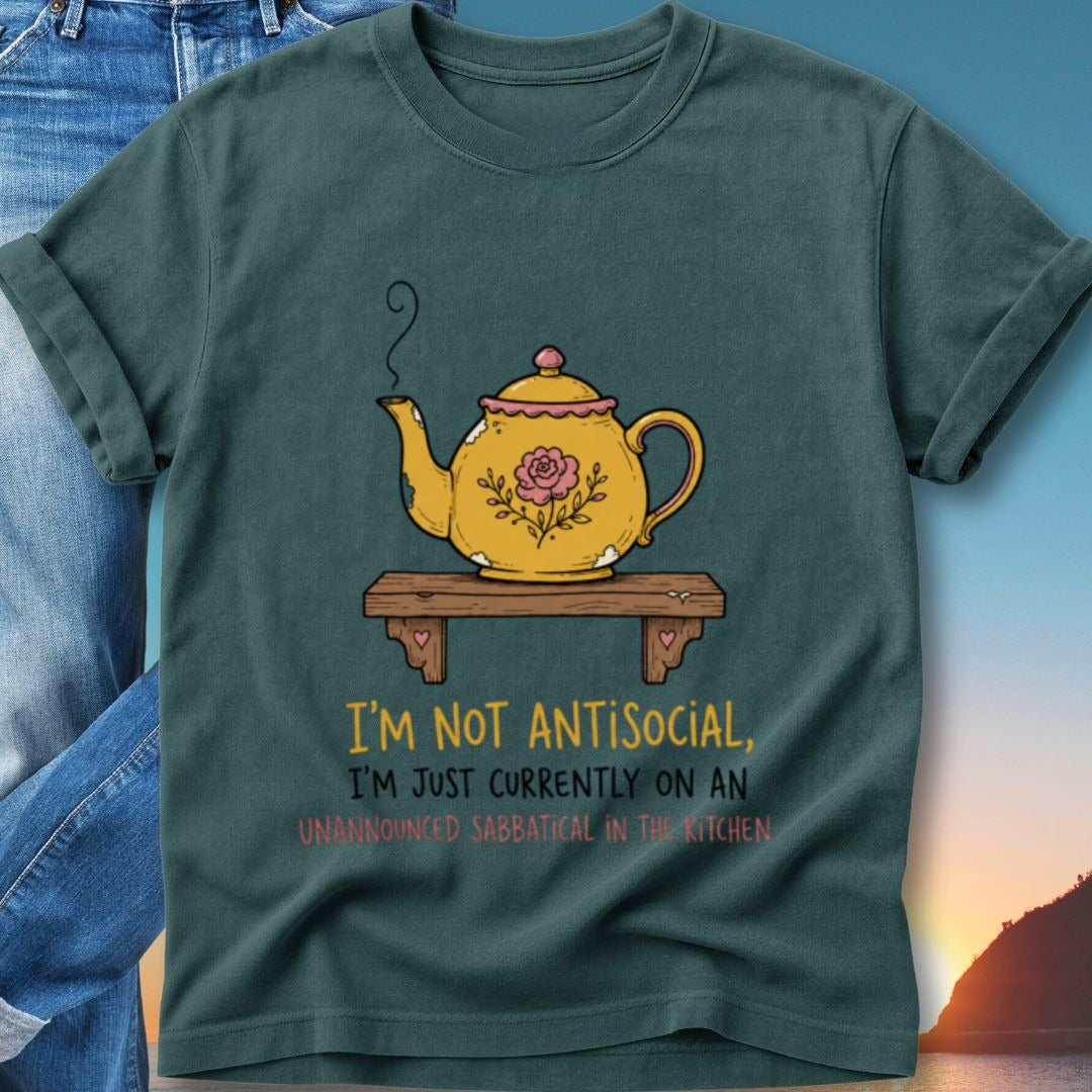 Teal t-shirt with yellow teapot illustration and text.