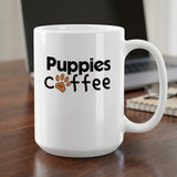 White mug with "Puppies and coffee" text and paw print design.