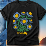 Black t-shirt with blue and yellow daisies and the word "friendly."