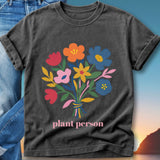 Dark t-shirt with a colorful bouquet of flowers and the text "plant person".