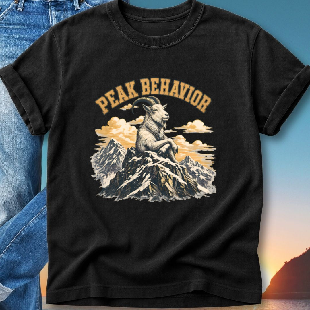 Black t-shirt with a goat sitting atop a mountain peak, "Peak Behavior" text above.