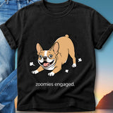 French Bulldog wearing a black t-shirt with "zoomies engaged." text.