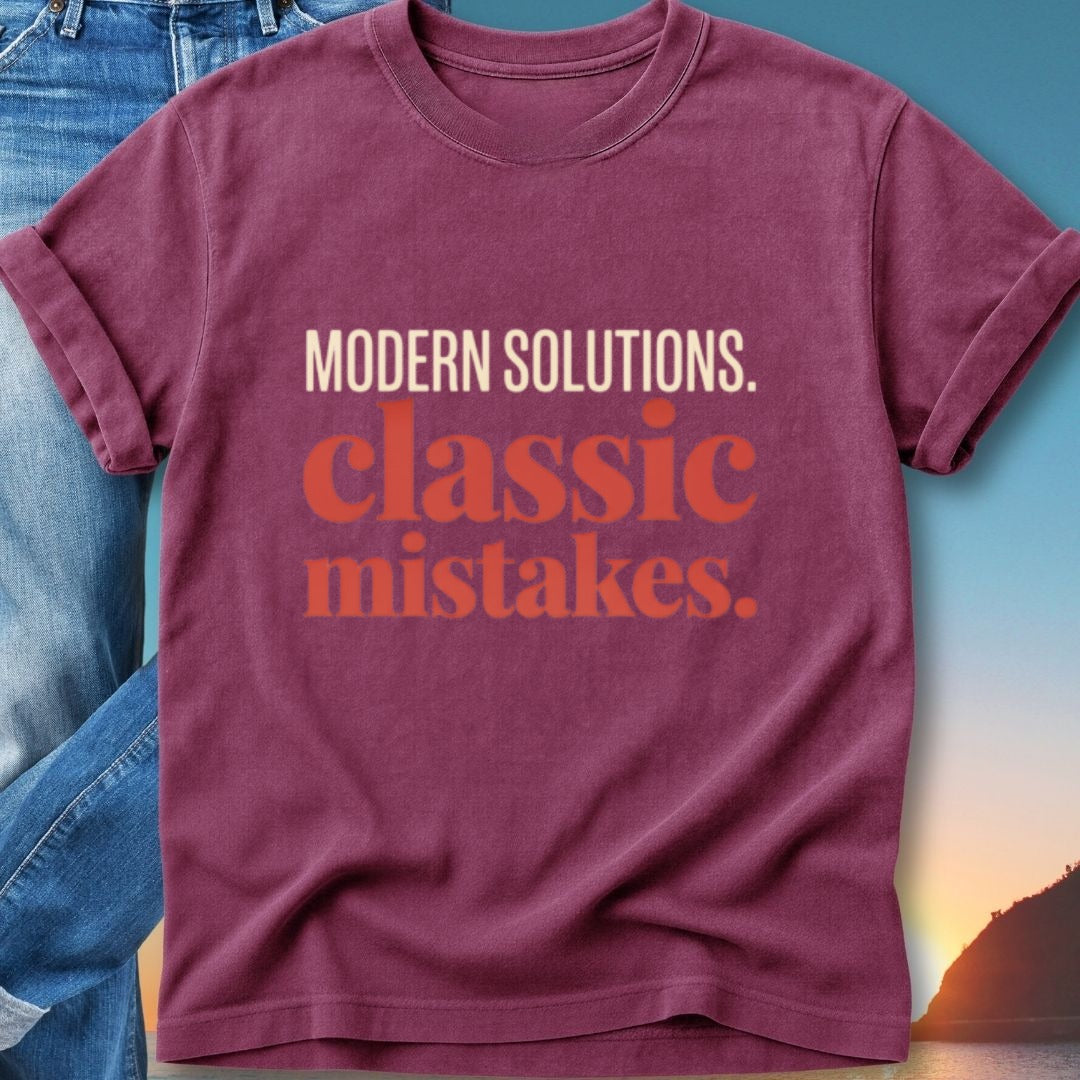 Maroon t-shirt with "MODERN SOLUTIONS. classic MISTAKES." text.