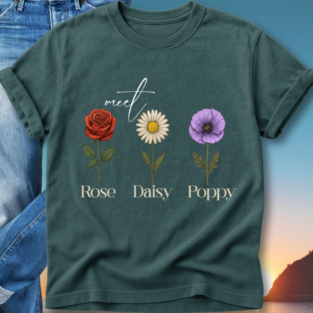 Green t-shirt with "meet Rose Daisy Poppy" and floral illustrations.