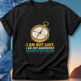 Black t-shirt with a compass graphic and text "I AM NOT LOST, I AM JUST AGGRESSIVELY EXPLORING MY OWN CONFUSION."