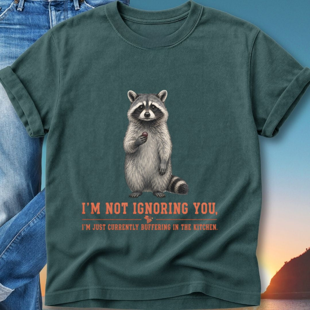 T-shirt with raccoon holding berry and text "I'm not ignoring you, I'm just currently buffering in the kitchen."
