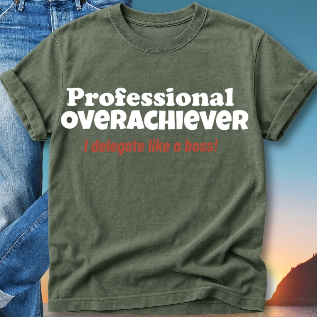Olive green t-shirt with white text "Professional Overachiever" and red text "delegate like a boss!".