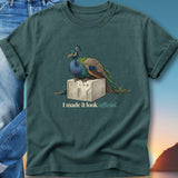 Peacock perched on vintage computer, text "I made it look official."