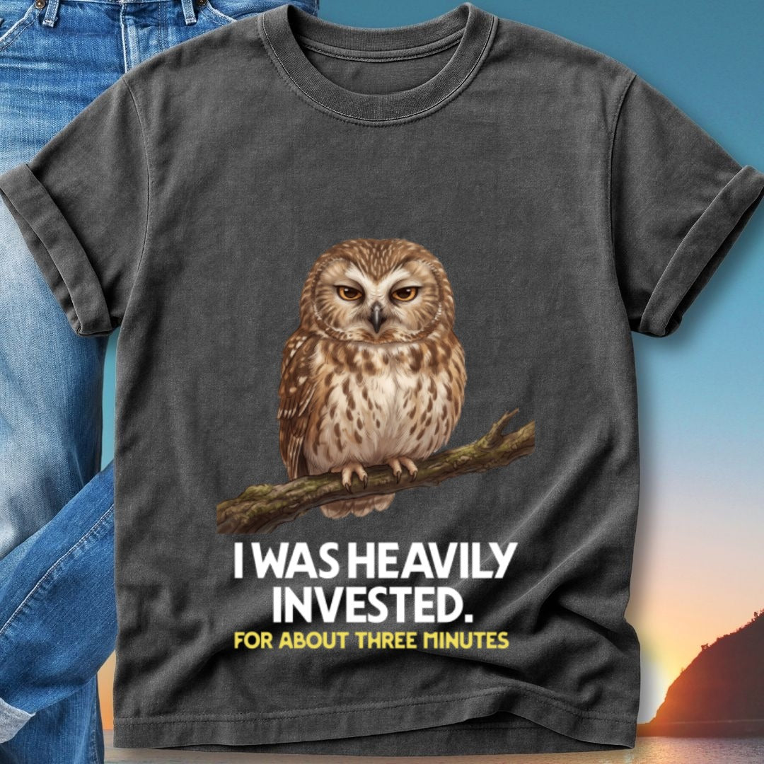 Dark gray t-shirt with owl on branch and text "I WAS HEAVILY INVESTED. FOR ABOUT THREE MINUTES."