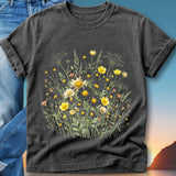 Dark t-shirt with a watercolor floral print featuring yellow and white wildflowers.