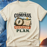 Cream t-shirt with "Trust the Compass, Question the Plan" text and compass graphic.