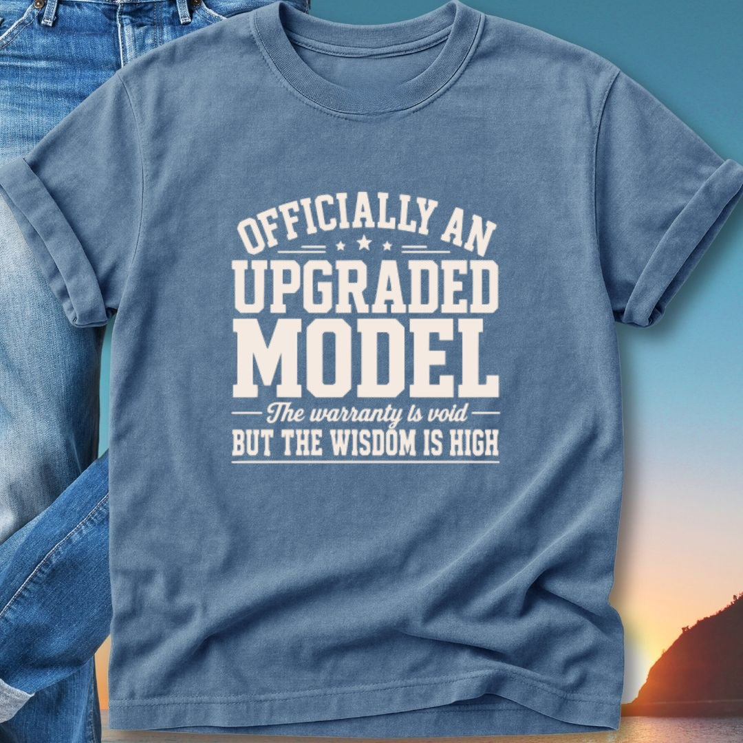 Blue t-shirt with white text: "Officially an Upgraded Model. The warranty is void - But the wisdom is high."