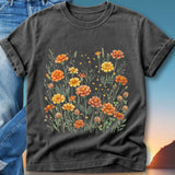 T-shirt with a watercolor floral design featuring orange and yellow marigolds.
