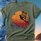 Olive t-shirt with vintage sunset climber graphic and mountains.
