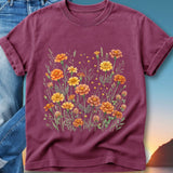 Maroon t-shirt with a watercolor illustration of orange and yellow marigolds.
