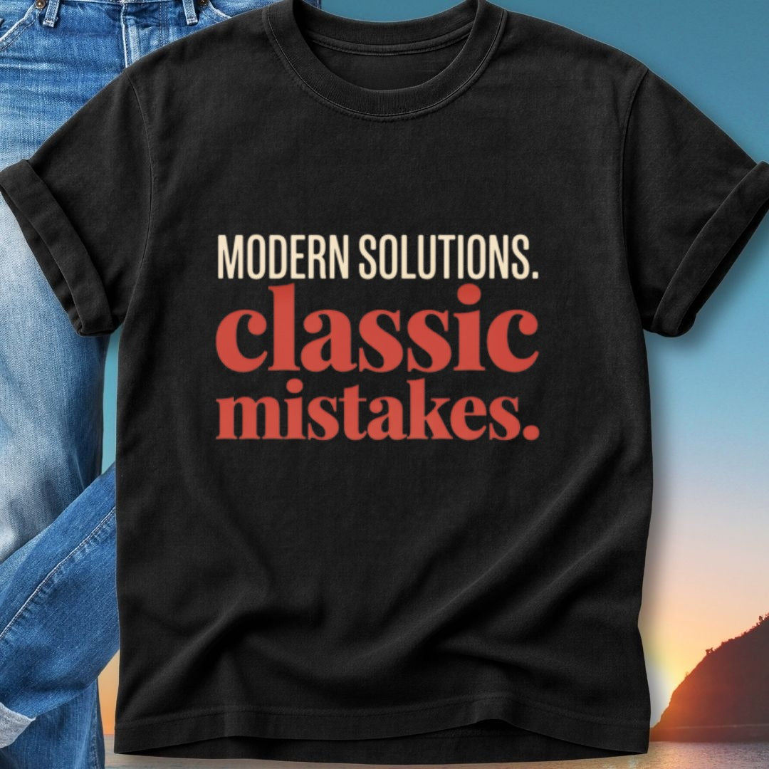 Black t-shirt with "Modern Solutions. Classic Mistakes." text in white and red.