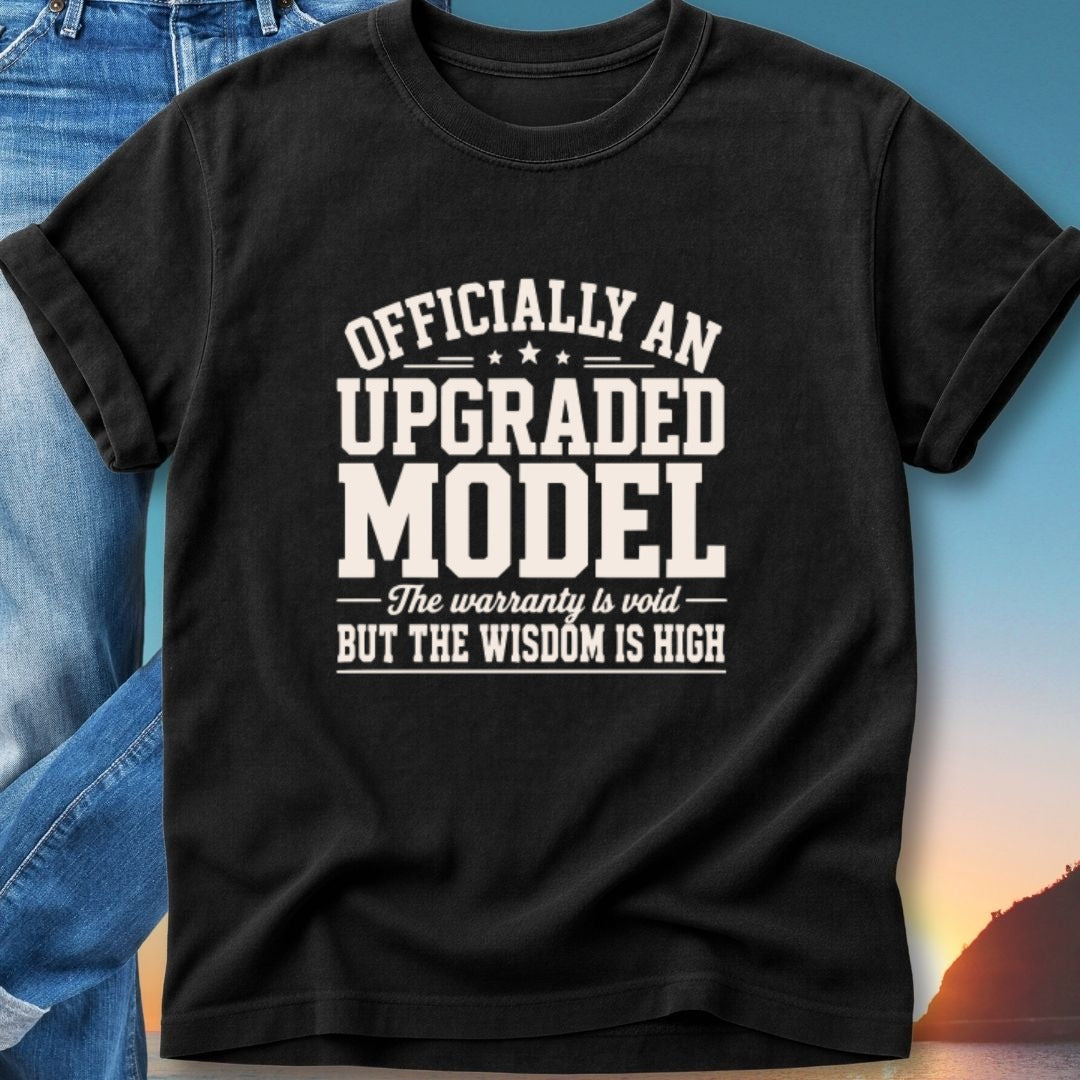 Black t-shirt with "Officially an upgraded model" and "The warranty is void but the wisdom is high" text.