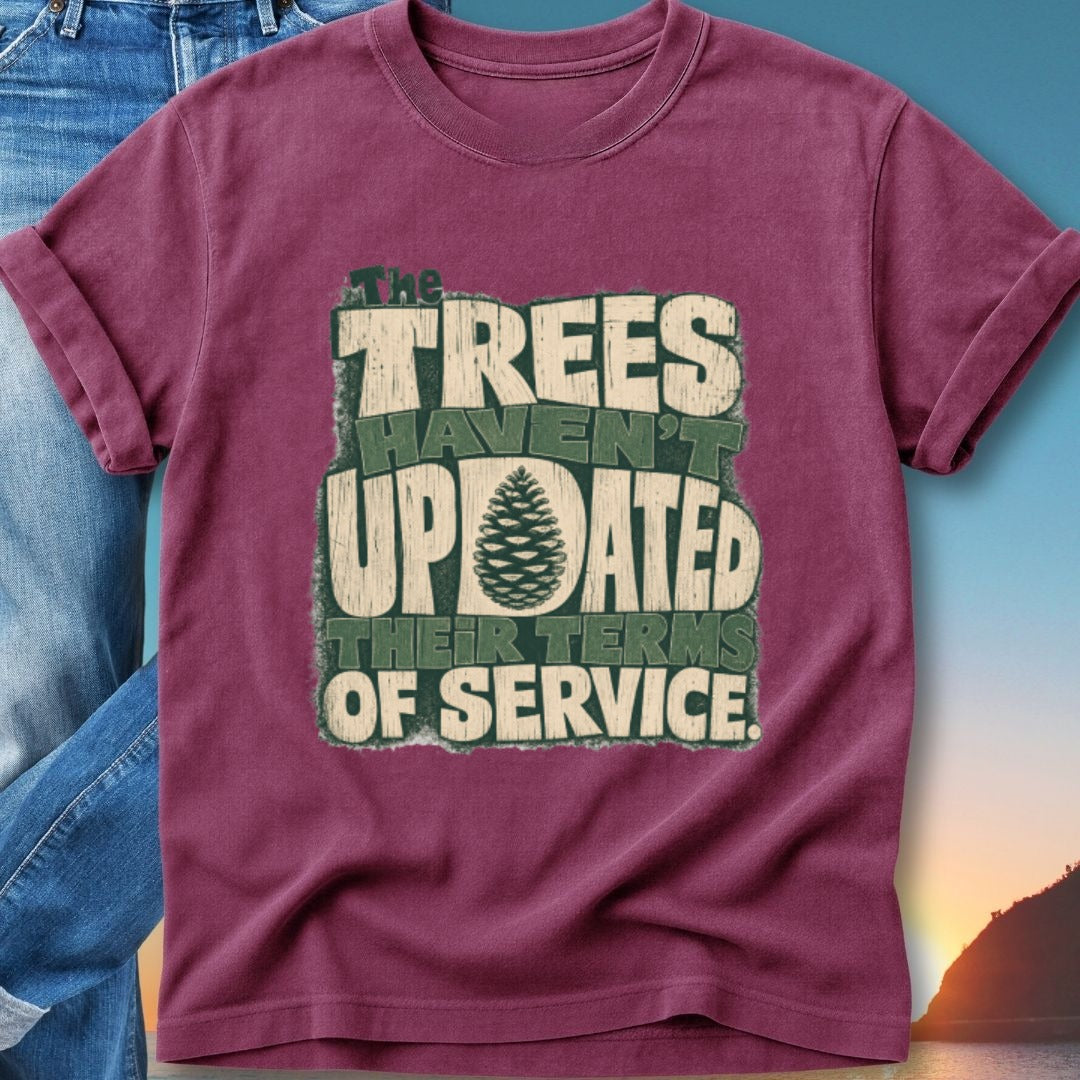 Burgundy t-shirt with "The Trees Haven't Updated Their Terms Of Service" text and pinecone graphic.