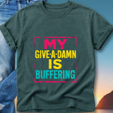 Dark t-shirt with "MY GIVE-A-DAMN IS BUFFERING" text in yellow and pink.