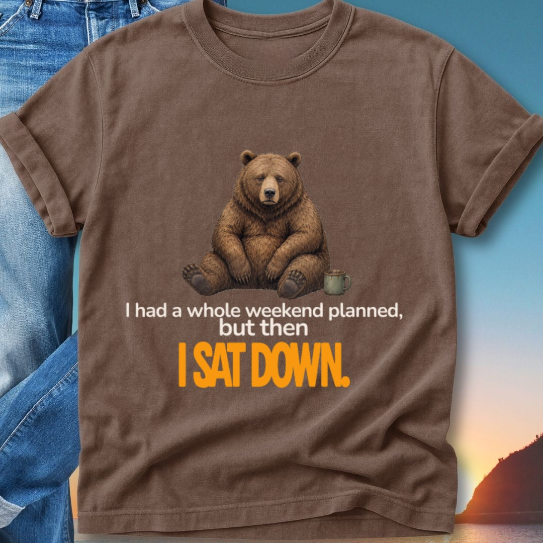 Brown t-shirt with a bear sitting by a mug, text reads "I had a whole weekend planned, but then I sat down."