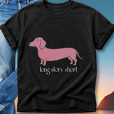 Black t-shirt with a pink dachshund graphic and "long story short" text.
