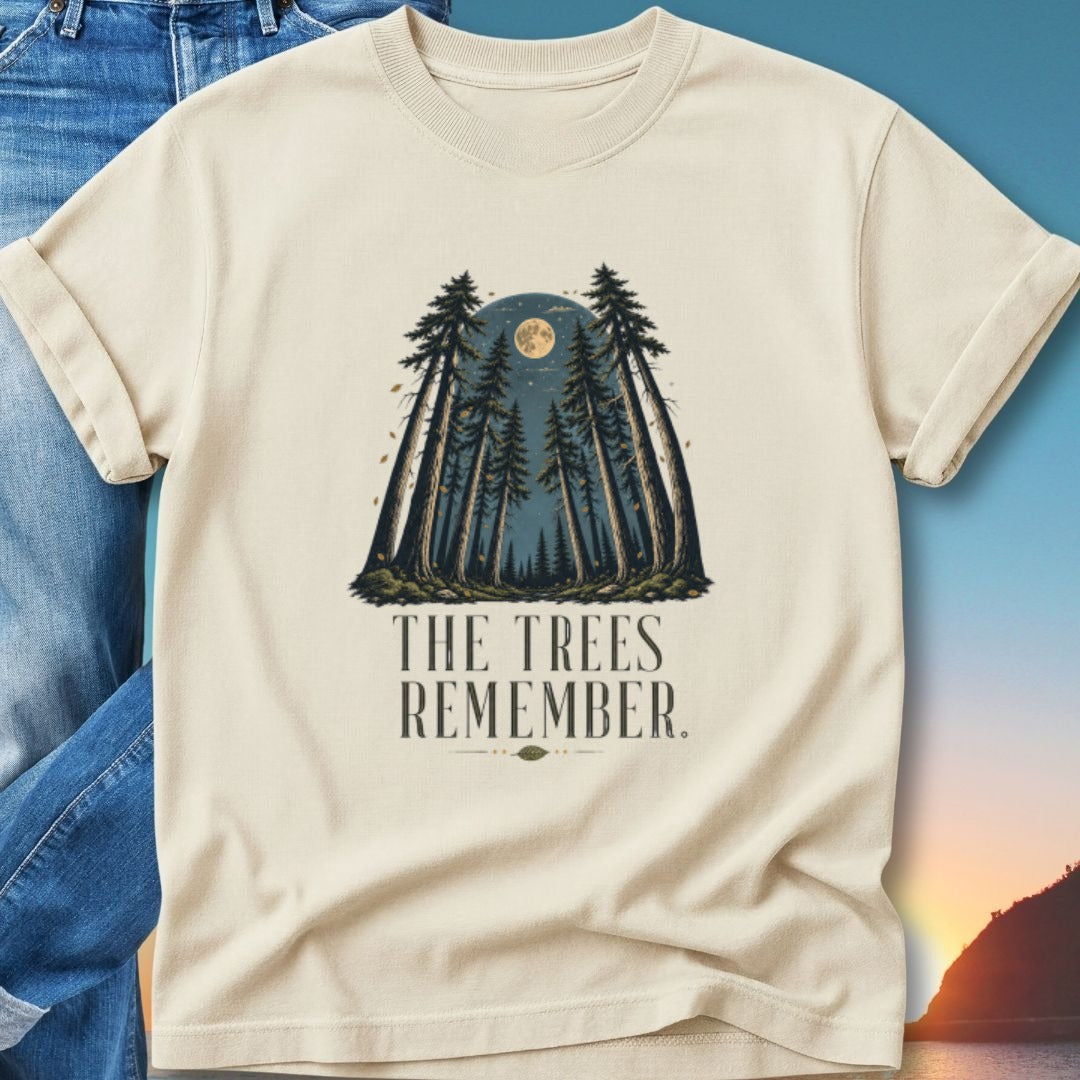 Cream t-shirt with forest silhouette, moon, and "The Trees Remember" text.