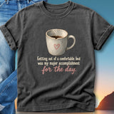 Dark t-shirt with a coffee mug and the text "Getting out of a comfortable bed was my major accomplishment for the day."