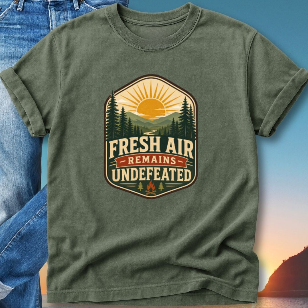 Olive t-shirt with "Fresh Air Remains Undefeated" graphic featuring mountains and sun.