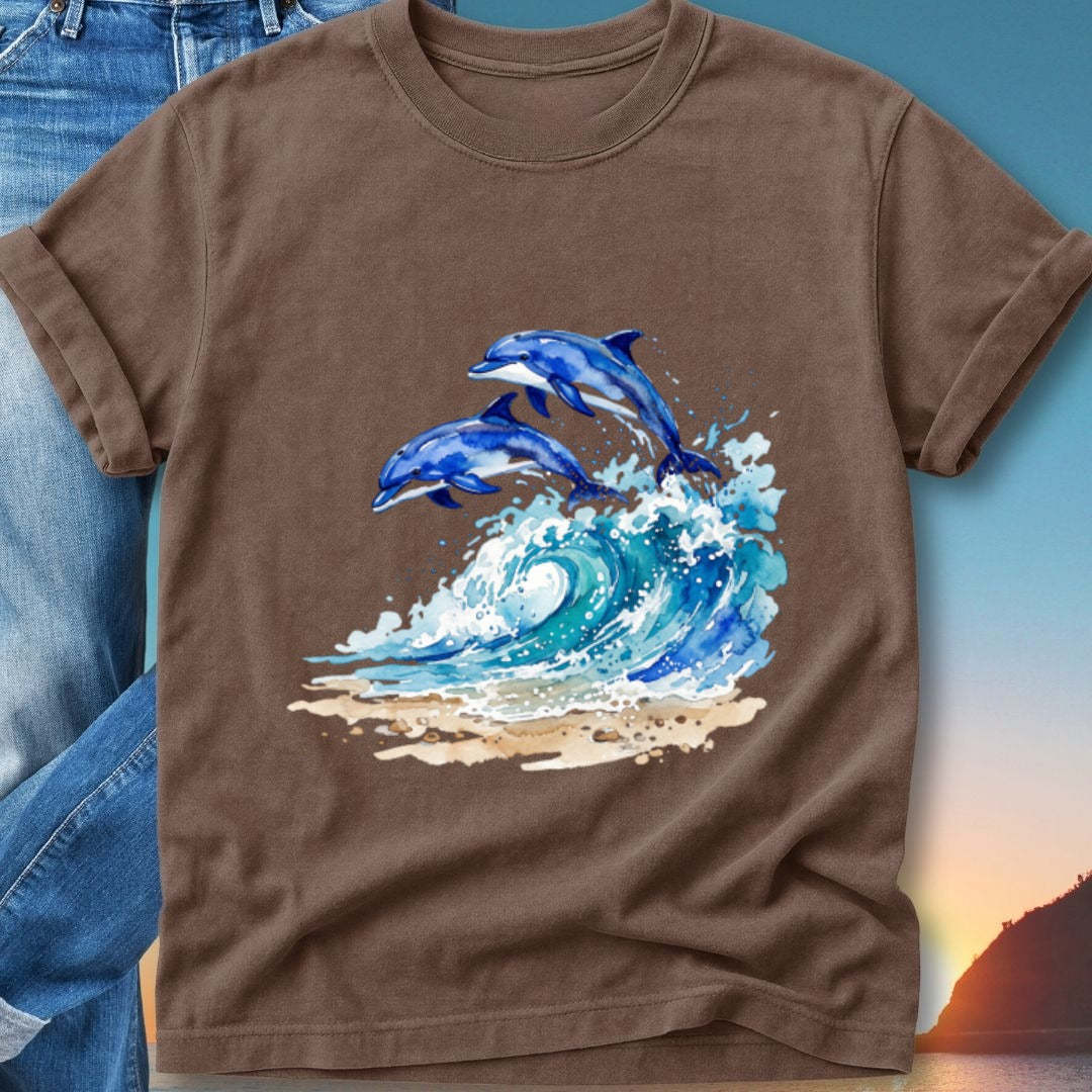 Two dolphins jump from a crashing wave onto a sandy beach at sunset.