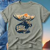 Moose silhouette with "Easily A-moosed" text, mountains, and trees.
