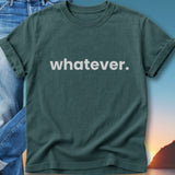 Teal t-shirt with "whatever." in white text, laid over denim.