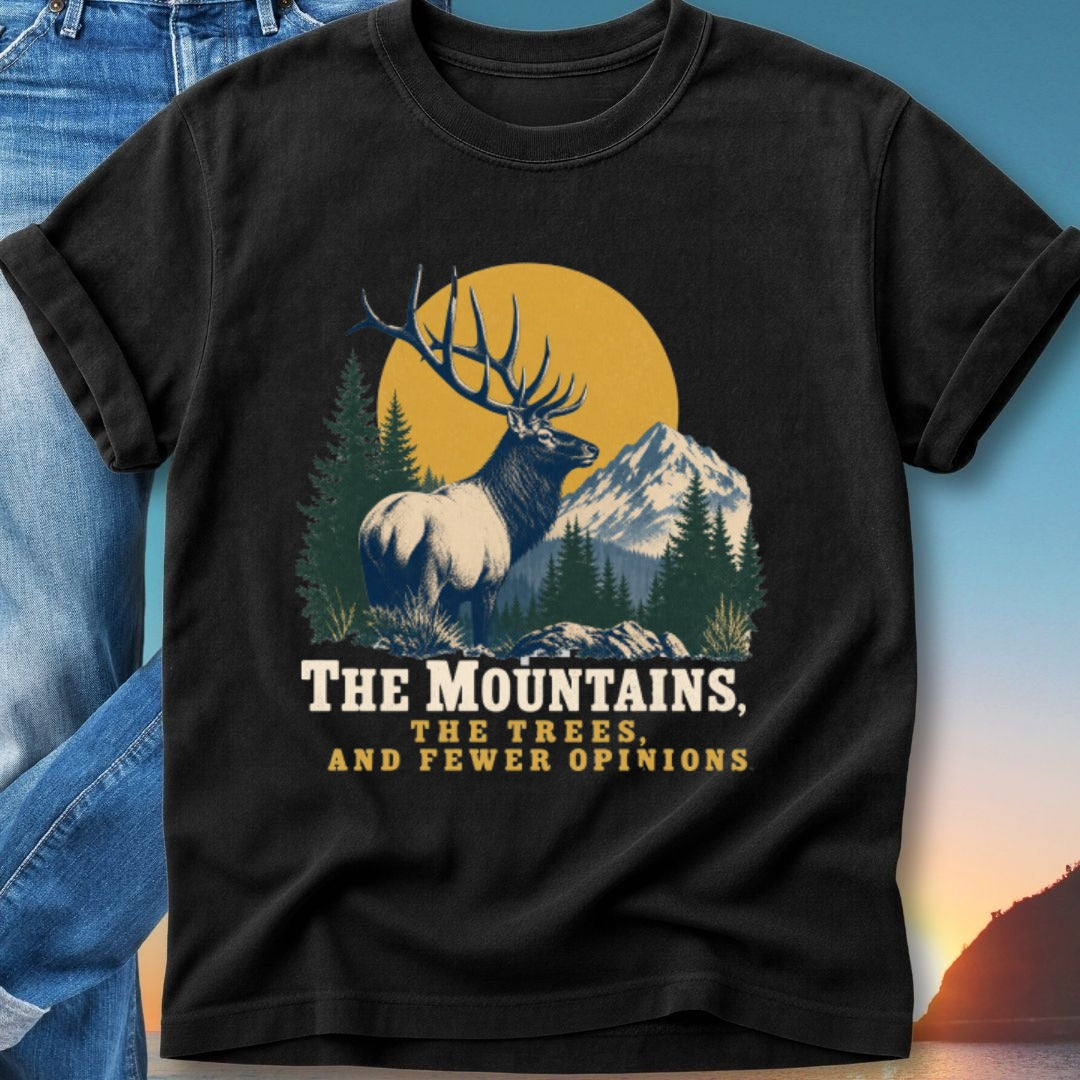 Black t-shirt with elk and mountains graphic, "The Mountains, The Trees, and Fewer Opinions."