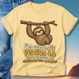 Yellow t-shirt with sloth on branch and text "I'm currently version 4.0. Fewer updates, but significantly better at napping."
