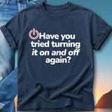 Navy t-shirt with white text "Have you tried turning it on and off again?".