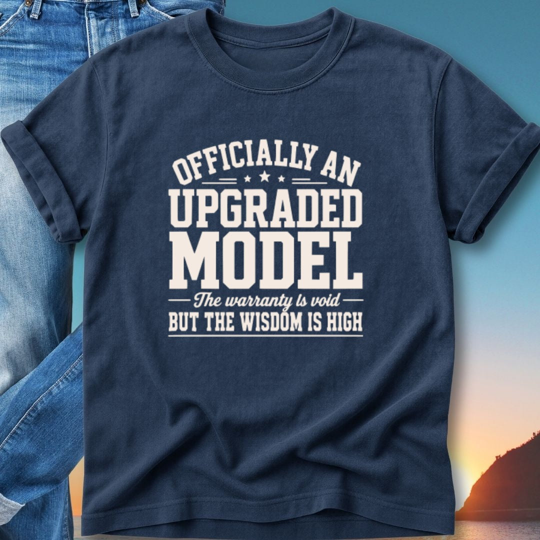 Dark blue t-shirt with "Officially an upgraded model, the warranty is void but the wisdom is high" text.
