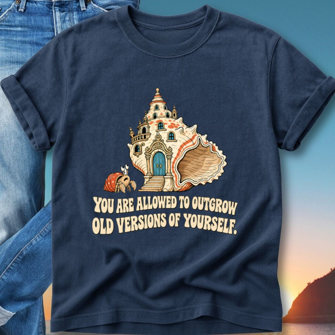 Dark blue t-shirt with a snail and seashell castle, text "YOU ARE ALLOWED TO OUTGROW OLD VERSIONS OF YOURSELF."