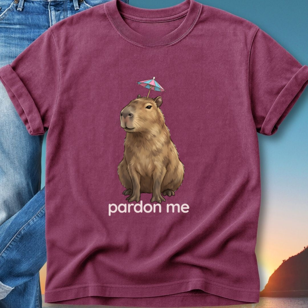 Burgundy t-shirt with a capybara wearing a tiny umbrella, text reads "pardon me".
