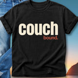 Black t-shirt with "couch bound." text in cream and red.