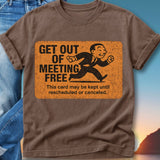 Brown t-shirt with orange sign reading "GET OUT OF MEETING FREE" and instructions.